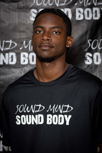 Anthony Sims, SMSB summer intern, wearing Sound Mind Sound Body t-shirt