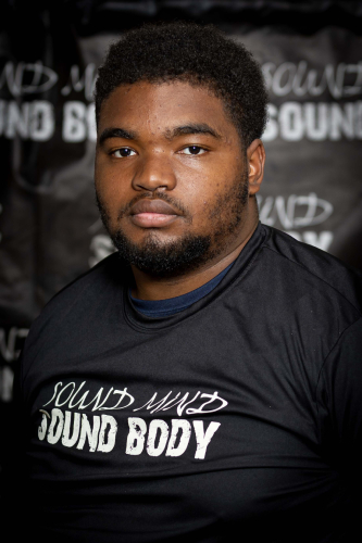 Malachi McGee, SMSB summer intern, wearing Sound Mind Sound Body t-shirt
