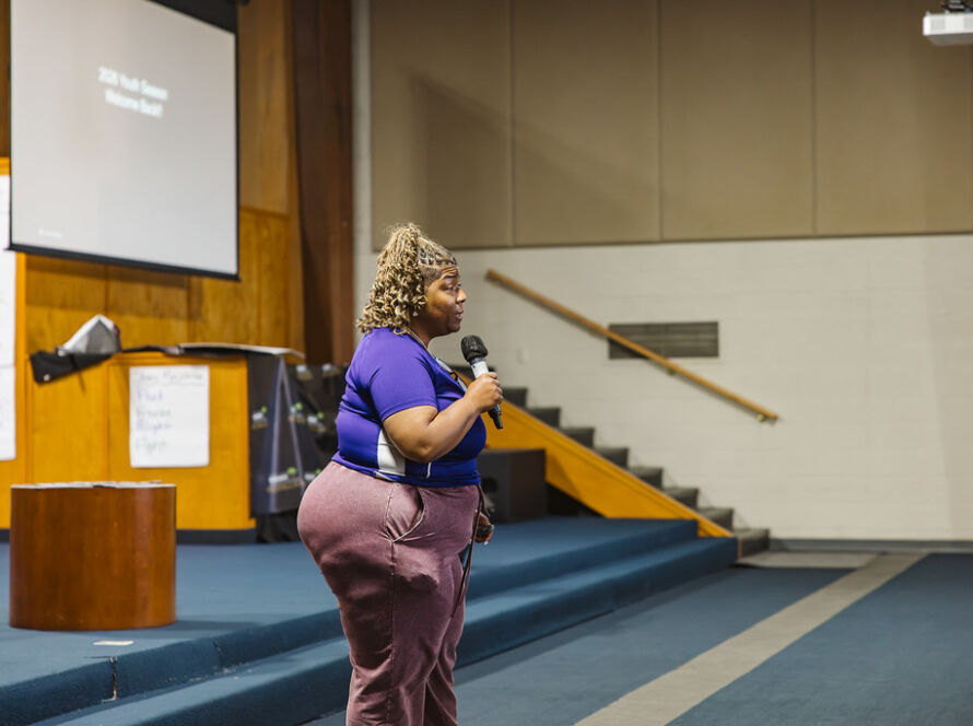 SMSB staff member speaking at Youth Impact Training